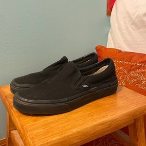 All black vans slip ons